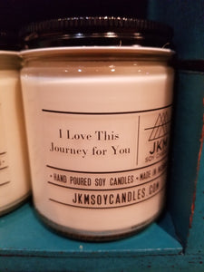 An "I Love This Journey For You" candle.